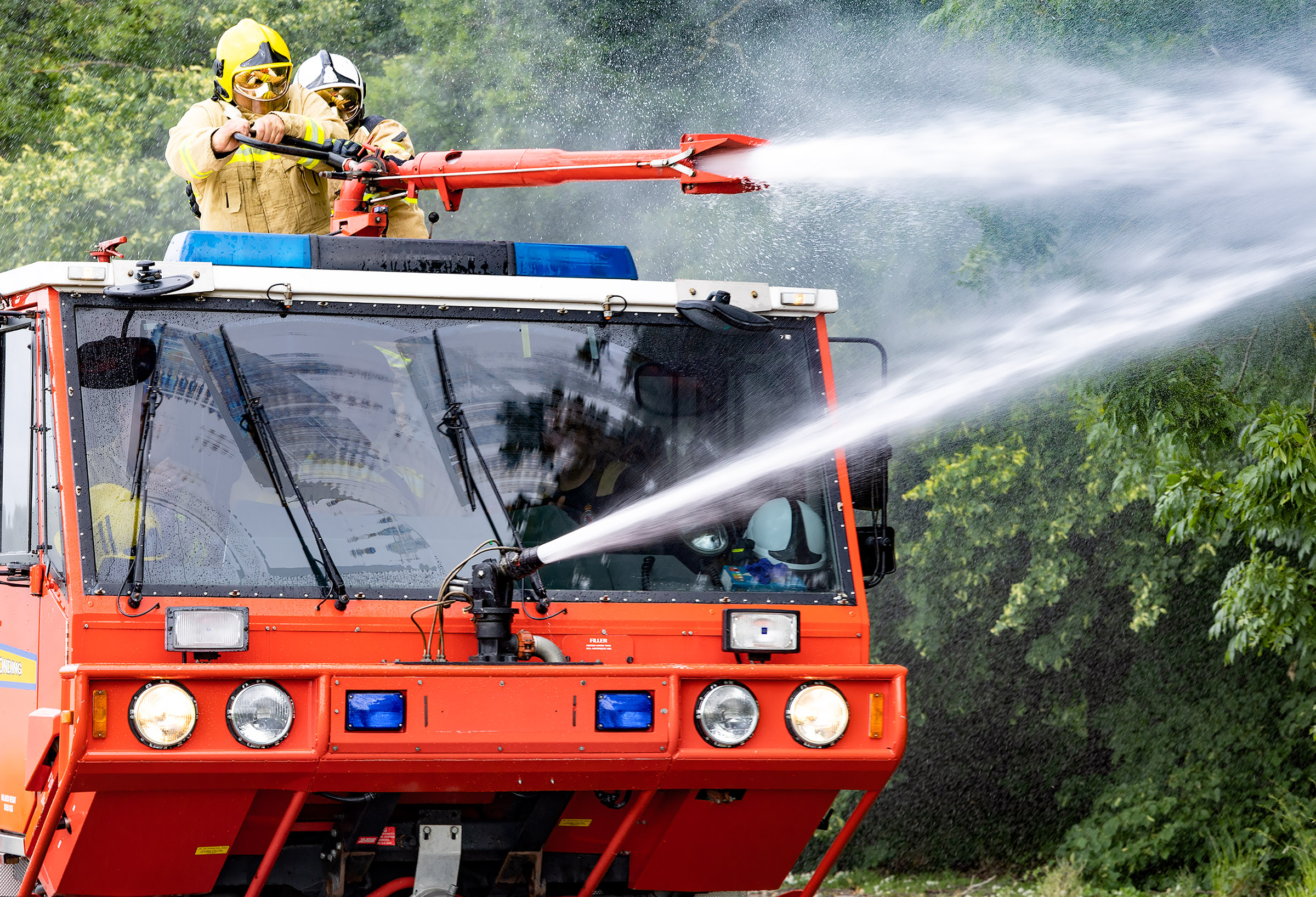 Firefighters operating the specialised fire engine